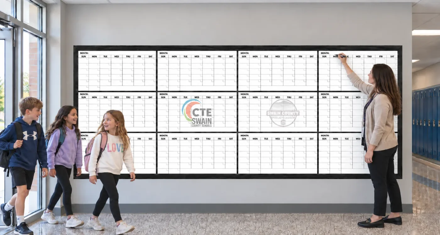 Custom printed yearly calendar whiteboard in a school hallway